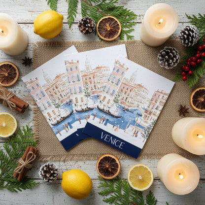 Venice-themed Christmas card with candles and decorative items on a wooden surface