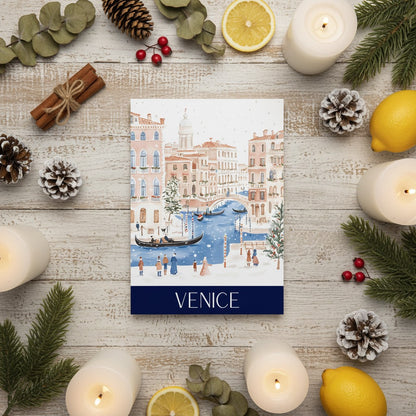 Venice-themed Christmas card surrounded by Christmas decorations on a wooden surface.