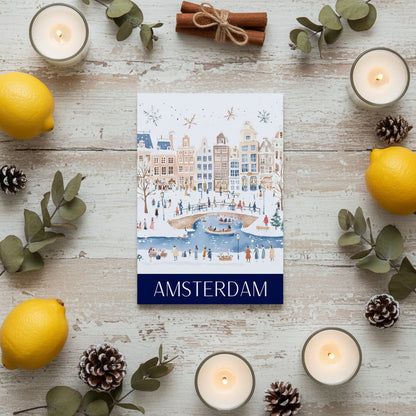 Greeting card with Amsterdam illustration surrounded by candles, lemons, and eucalyptus leaves on a wooden surface.